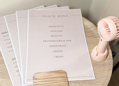 Snack menu and table fan at Hair Extensions by Anarika in Hounslow, England, GB.