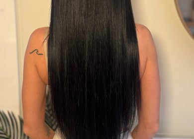 Sleek long black hair extensions by Hair Extensions by Anarika in Hounslow, England, GB.