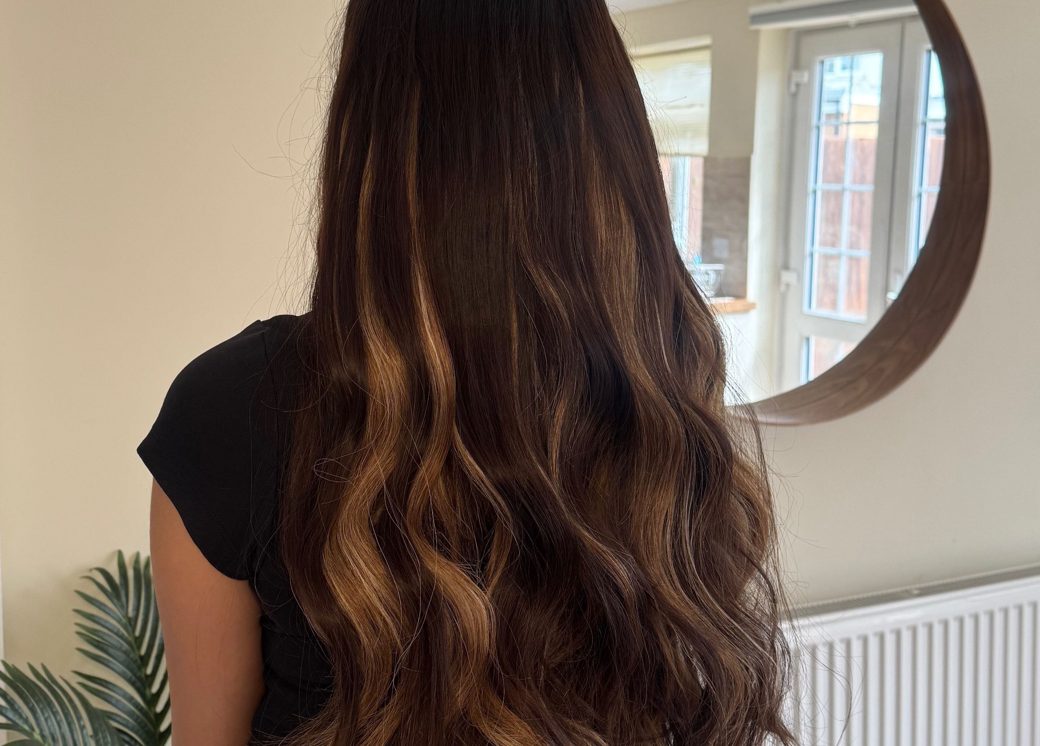 Beautiful long wavy hair styled at Hair Extensions by Anarika, Hounslow, England, GB.