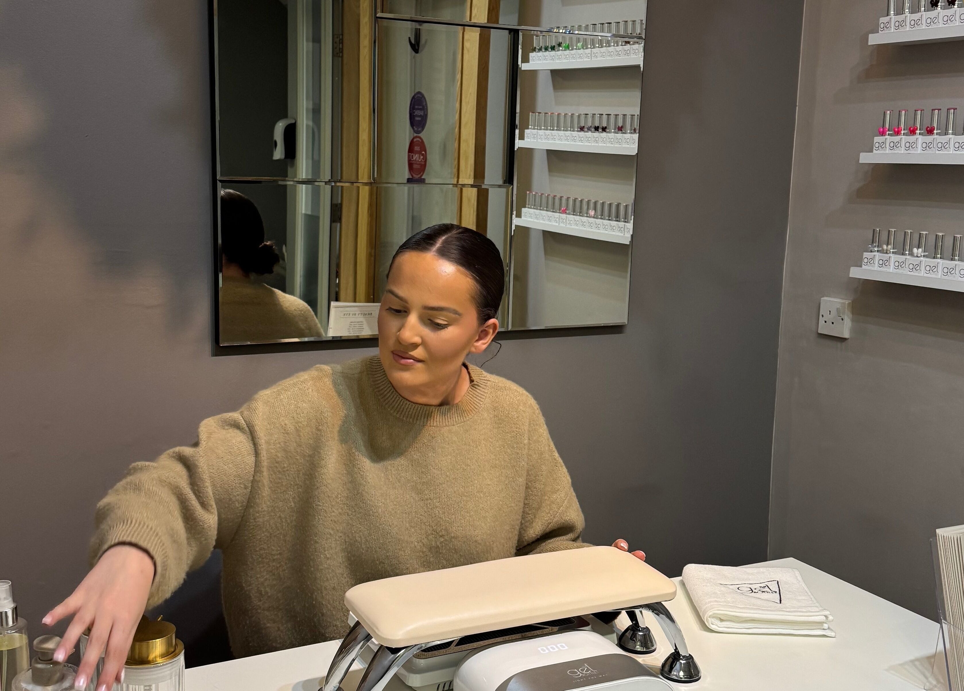 Nail technician at BeautyByEve in Sidmouth, England, GB preparing for a manicure session.
