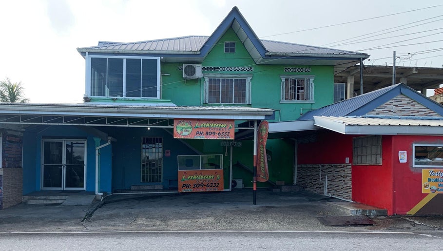 The Reset Bar’s vibrant, colorful facade in Sangre Grande, TT showcasing its inviting exterior design.
