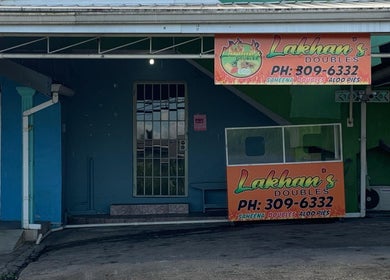 Entrance to The Reset bar in Sangre Grande, TT, showcasing Lakhan's Doubles stand.
