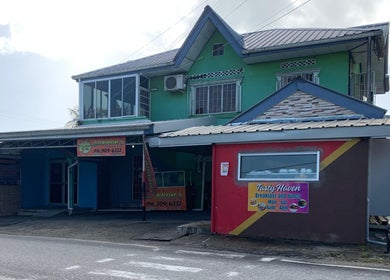 Front view of The Reset bar at Sangre Grande, TT, highlighting the venue's distinctive architecture.