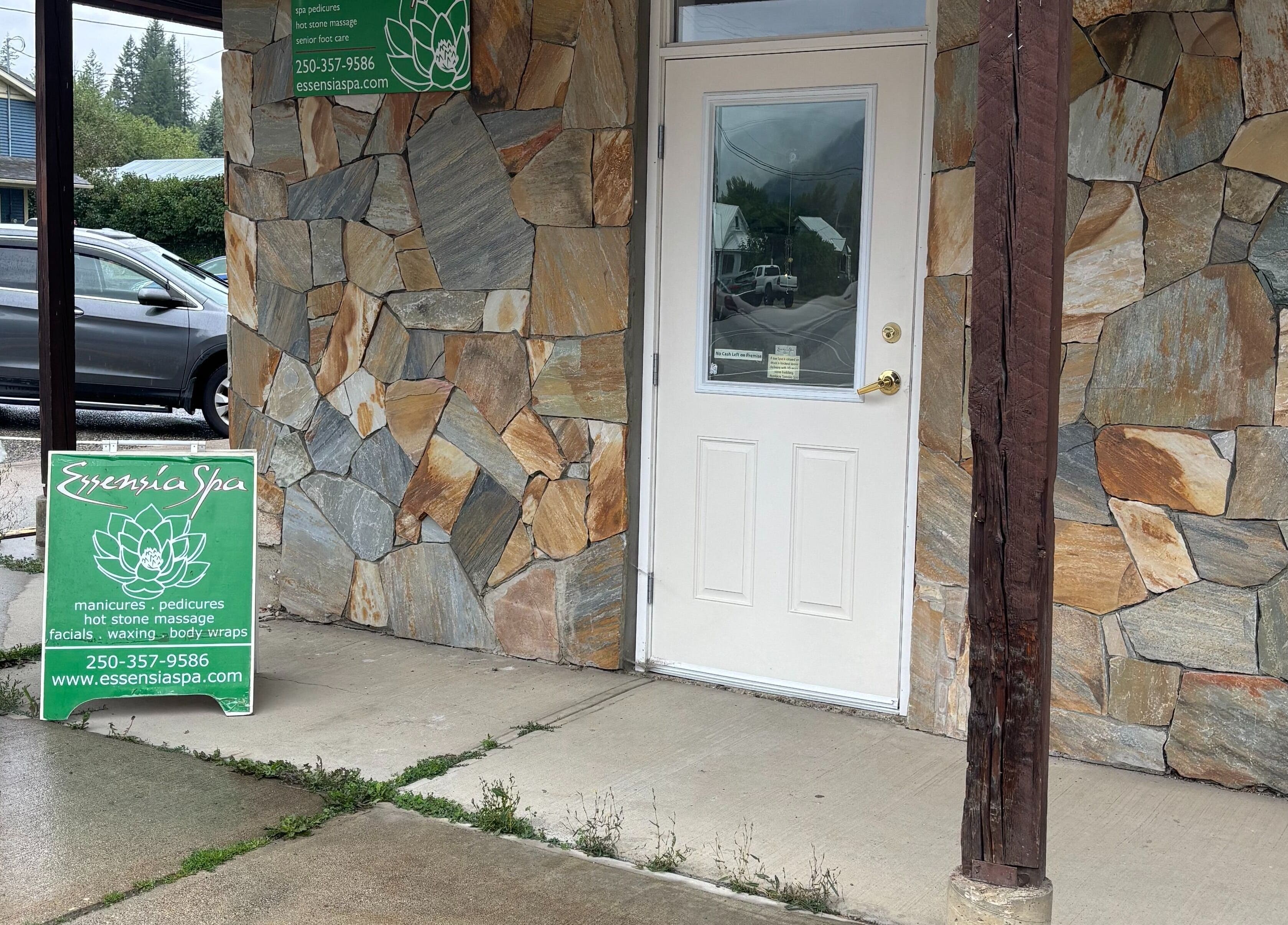 Essensia Spa entrance with stone facade in Salmo, British Columbia, CA.