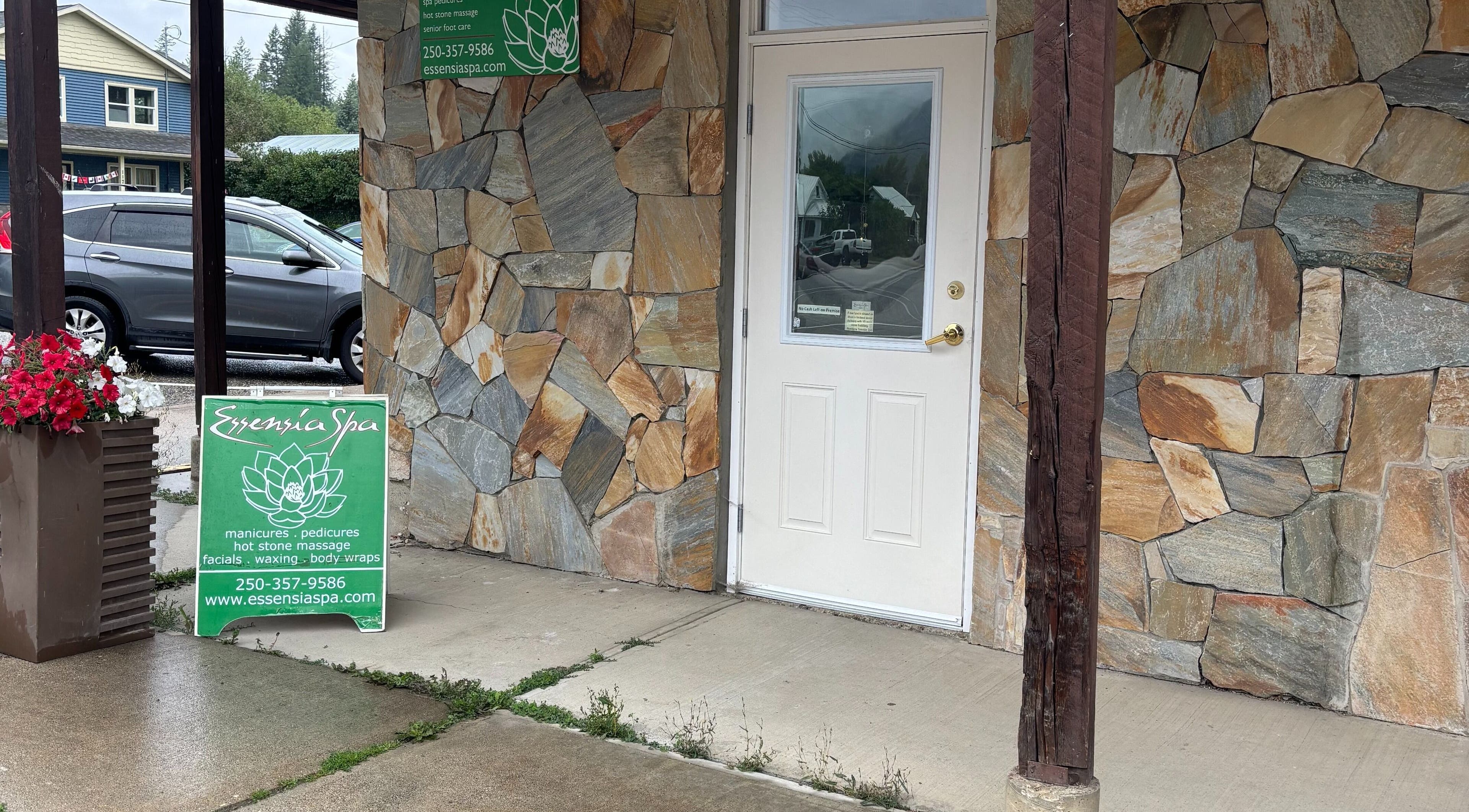 Essensia Spa entrance with stone facade in Salmo, British Columbia, CA.