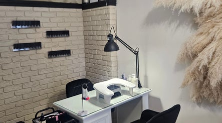 Modern nail station at Shaped by Shannon, Stafford, England, GB with chic decor and white brick wall.