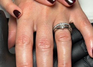 Close-up of manicured nails with dark polish at Shaped by Shannon, Stafford, England, GB.