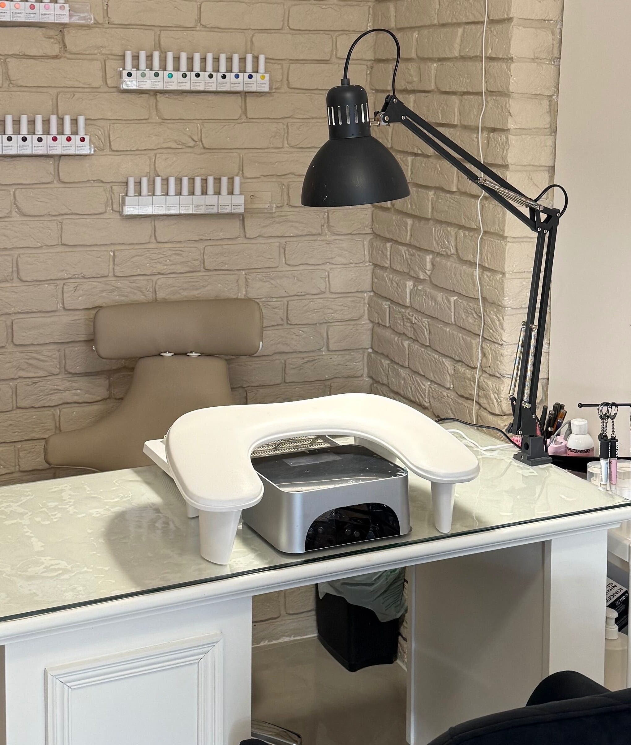 Nail station at Shaped by Shannon in Stafford, England, GB, featuring chic decor and manicure tools.