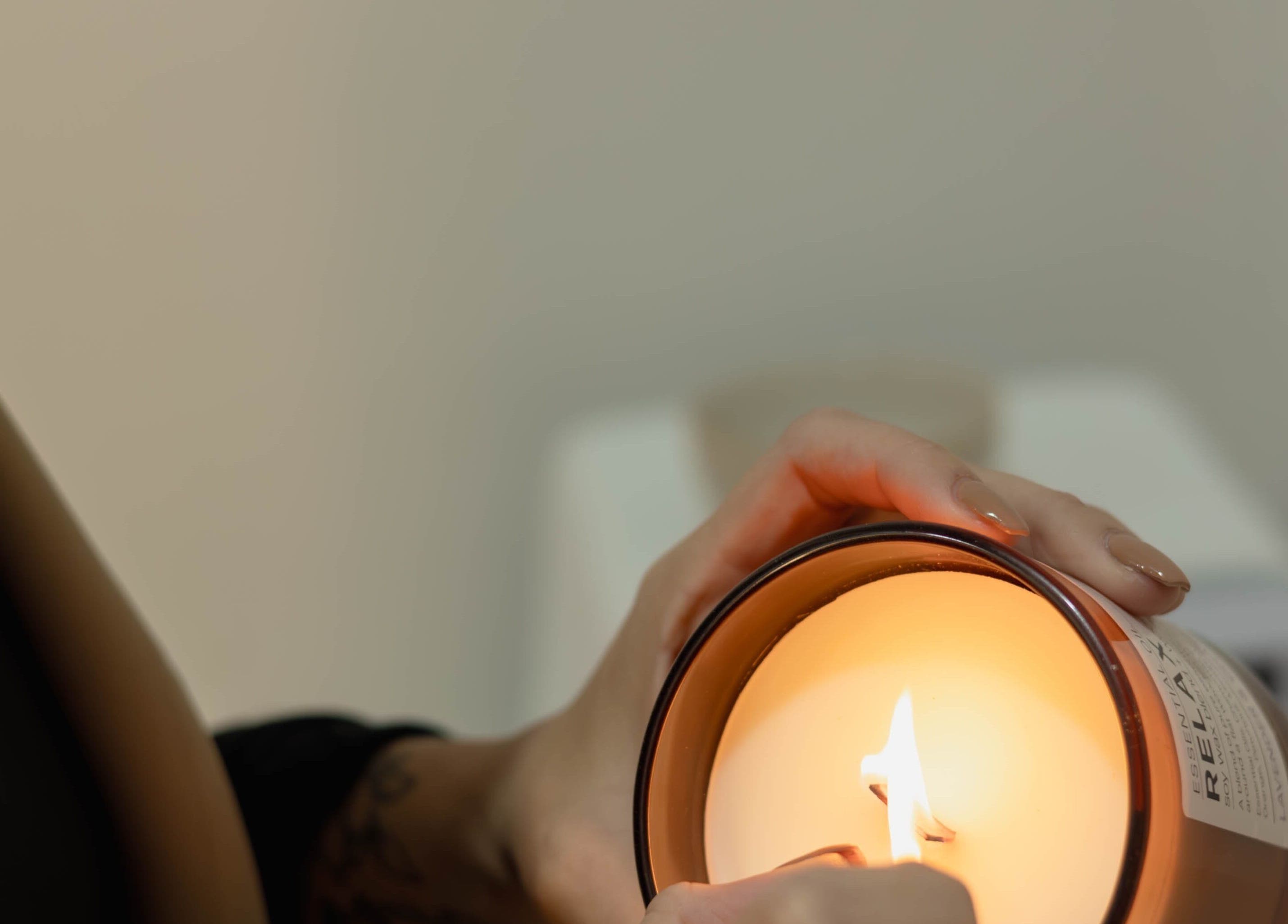 Warm candle being lit at Omorphia Beauty in Budgewoi, New South Wales, AU for a serene ambiance.