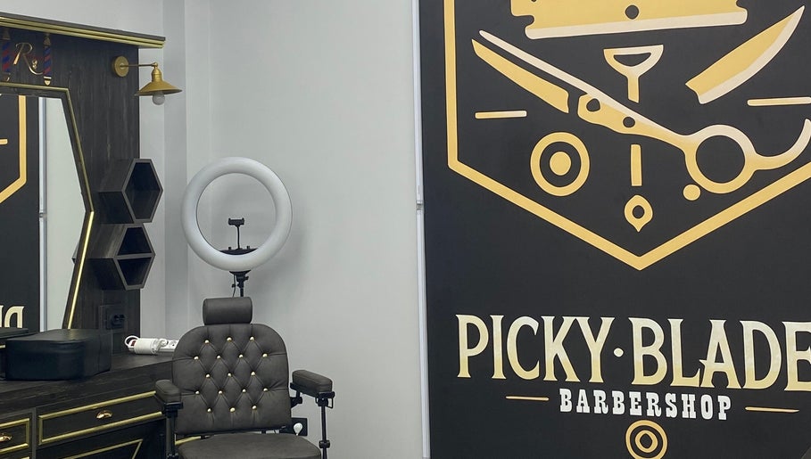 Stylish interior at Picky Blades Barbershop in Durleşti, Chișinău, MD, showcasing modern barber chair and decor.