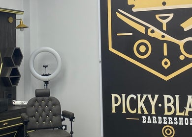 Stylish interior at Picky Blades Barbershop in Durleşti, Chișinău, MD, showcasing modern barber chair and decor.