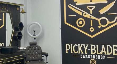 Stylish interior at Picky Blades Barbershop in Durleşti, Chișinău, MD, showcasing modern barber chair and decor.