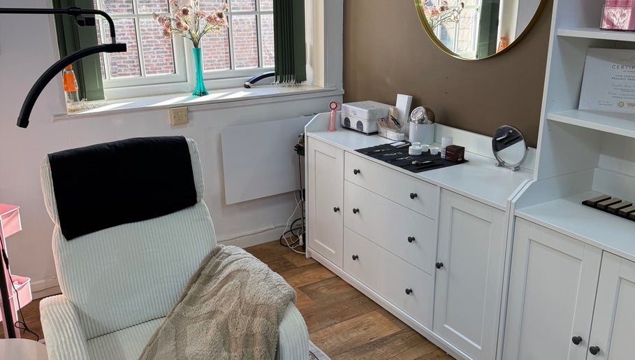 Relaxing treatment room at Beauty by Brydie, Thirsk, England, GB featuring a cozy chair and elegant decor.