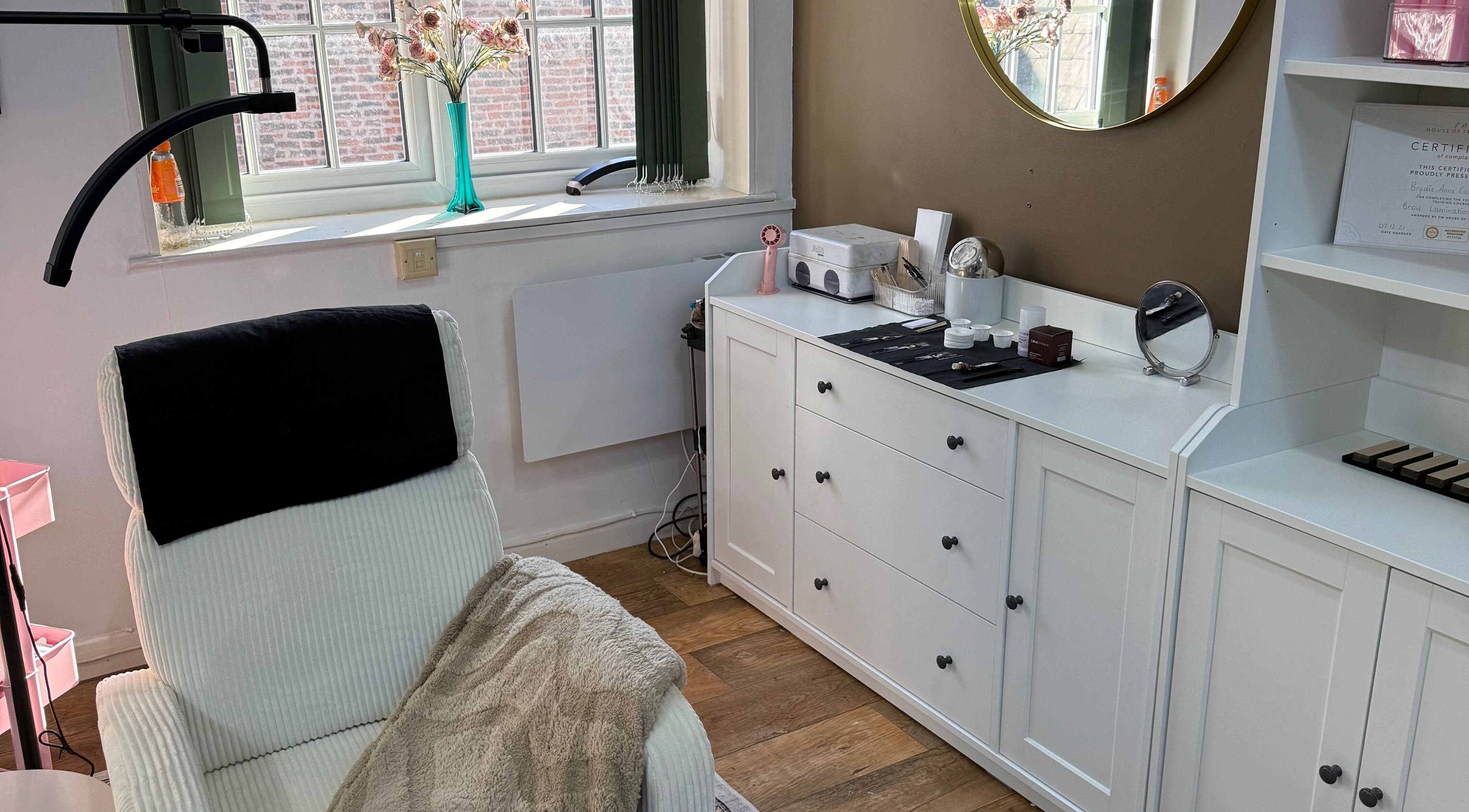 Relaxing treatment room at Beauty by Brydie, Thirsk, England, GB featuring a cozy chair and elegant decor.
