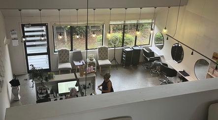 Inside Sykes Sports Massage Therapy, Auckland, NZ: bright, spacious studio with chairs and mirrors.