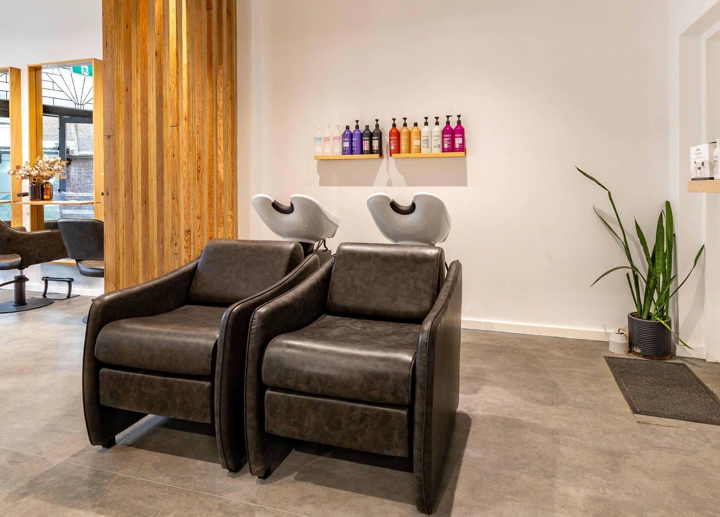 Stylish interior of Collective and Co Coogee salon in Coogee, New South Wales, AU with modern wash stations.