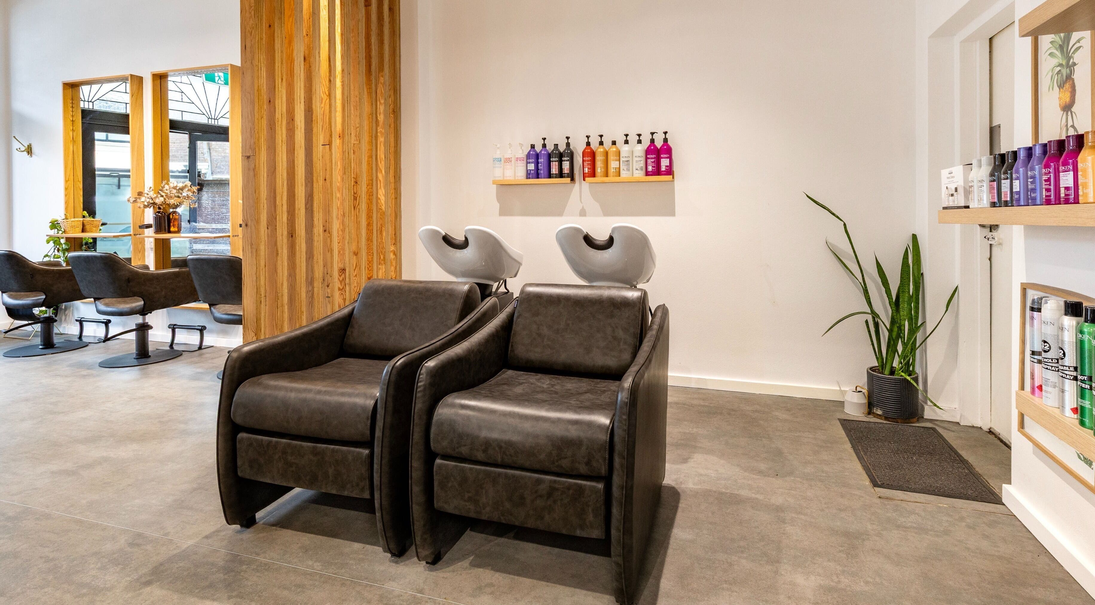 Stylish interior of Collective and Co Coogee salon in Coogee, New South Wales, AU with modern wash stations.