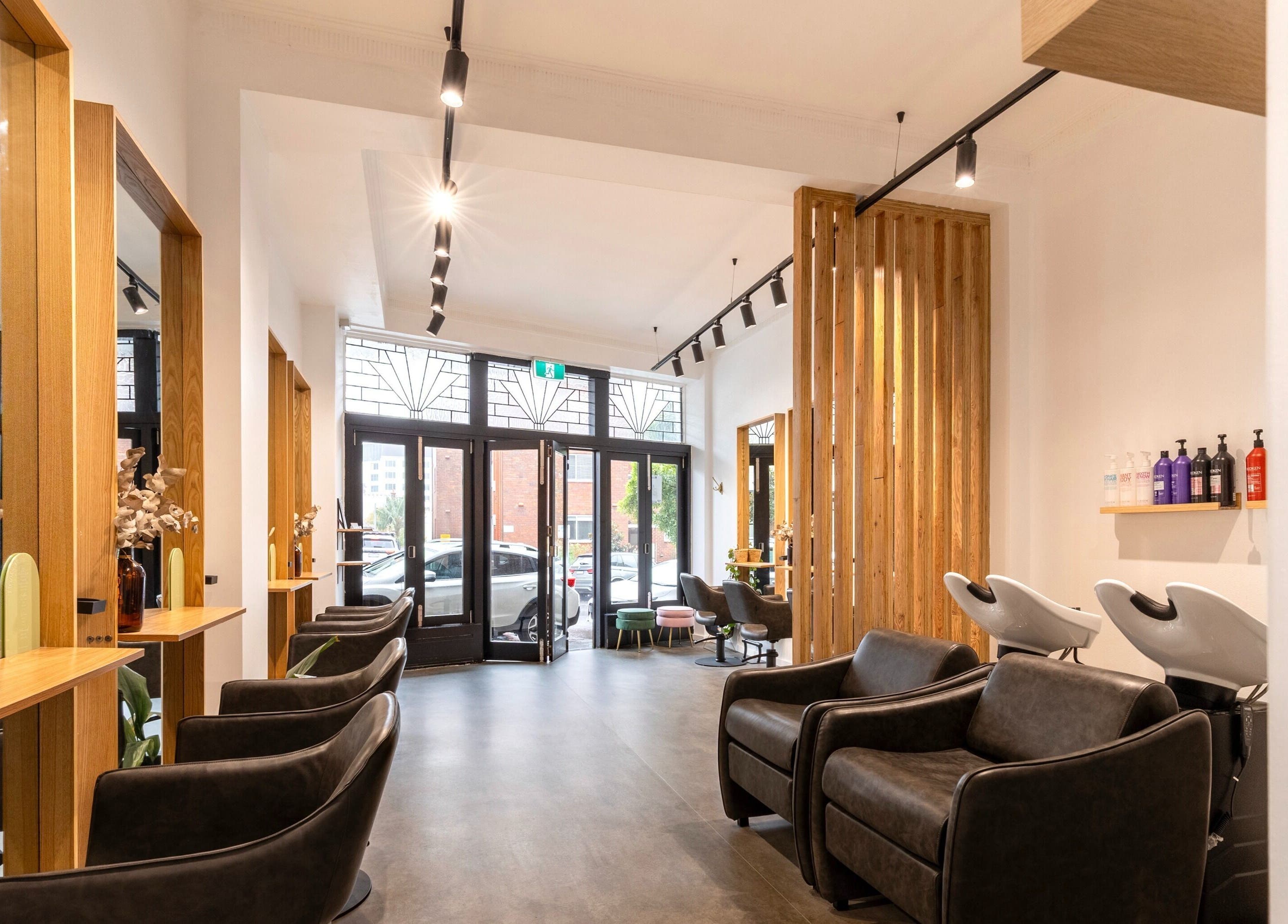 Chic interior of Collective and Co Coogee salon, Coogee, New South Wales, AU with modern styling stations.