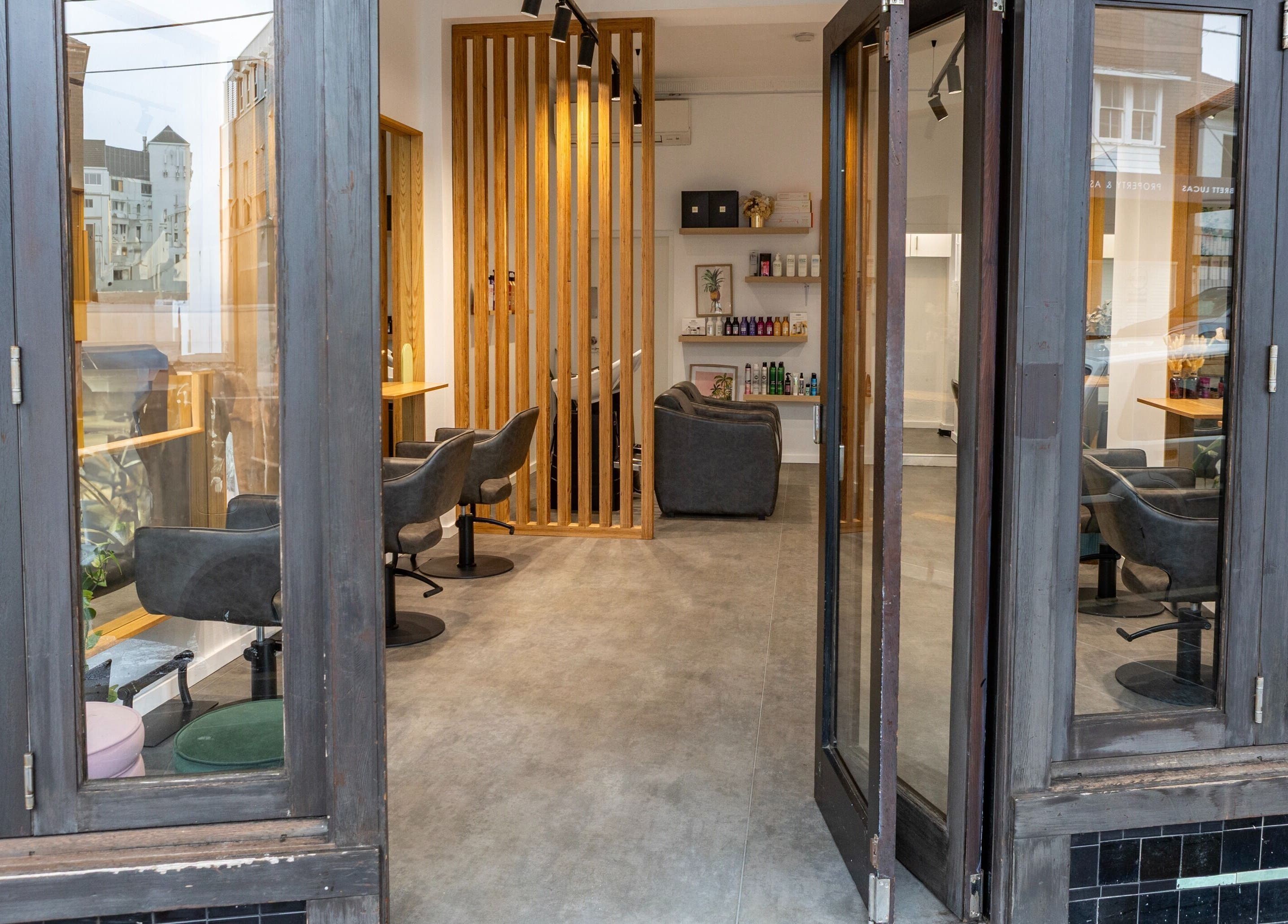 Chic salon interior at Collective and Co Coogee, Coogee, New South Wales, AU showcasing elegant seating.