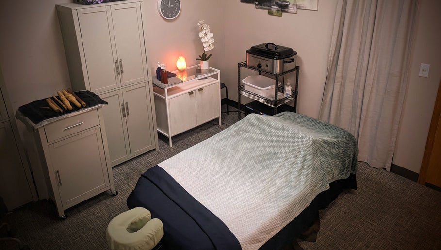 Tranquil massage room at Blue Orchid Massage, Denver, Colorado, US with soft lighting and soothing decor.
