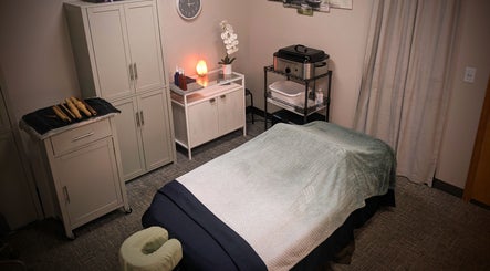 Tranquil massage room at Blue Orchid Massage, Denver, Colorado, US with soft lighting and soothing decor.