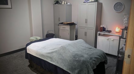 Relaxing massage room at Blue Orchid Massage in Denver, Colorado, US with a cozy therapy bed.