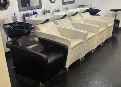 Elegant shampoo chairs at ASHIYA'S, Jersey City, New Jersey, US, showcasing modern beauty venue design.