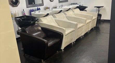 Elegant shampoo chairs at ASHIYA'S, Jersey City, New Jersey, US, showcasing modern beauty venue design.