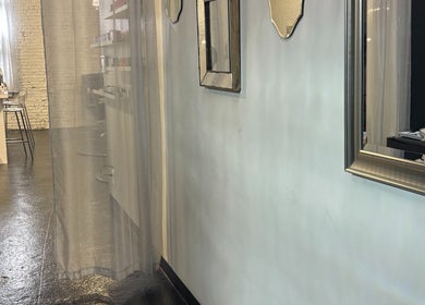 ASHIYA'S chic interior showcasing mirrors and a nail station in Jersey City, New Jersey, US.