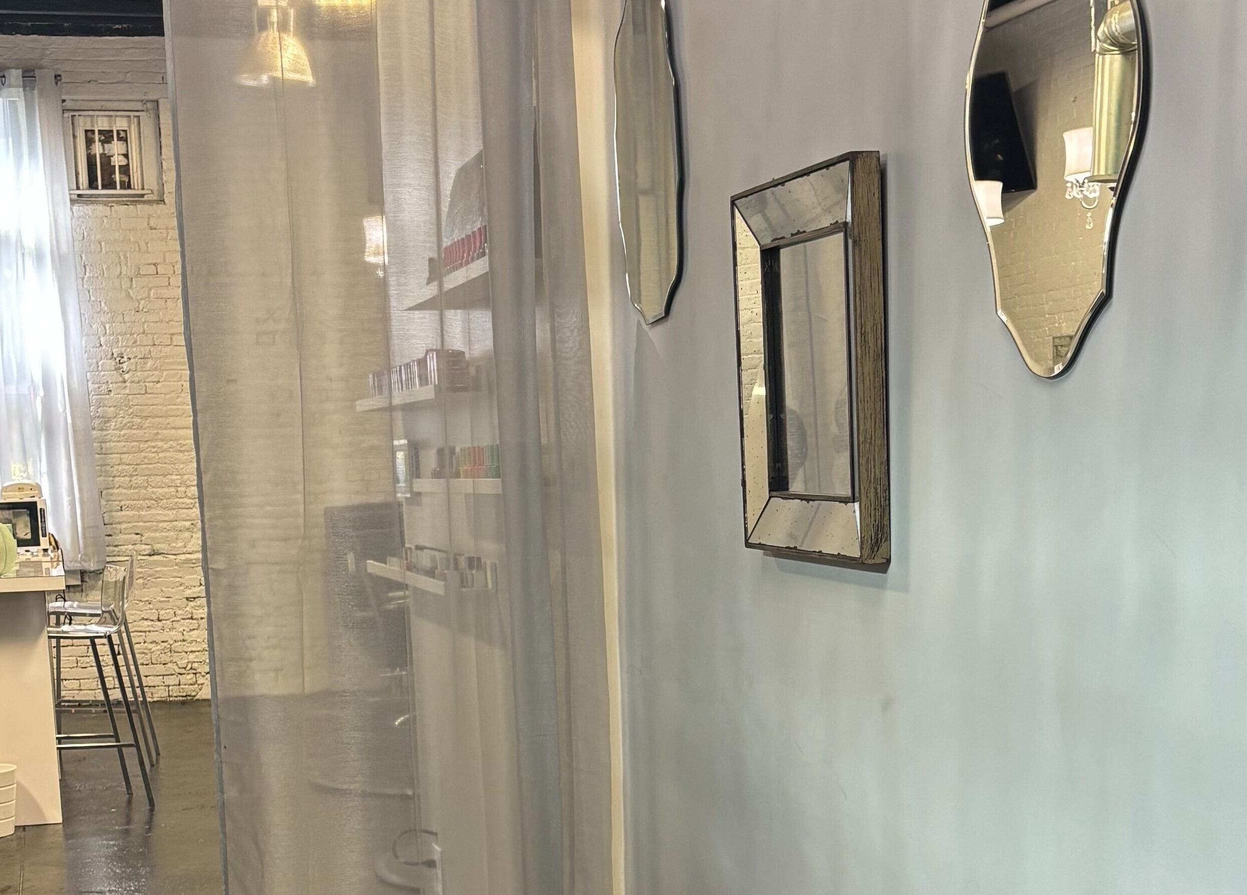 ASHIYA'S chic salon interior with stylish mirrors in Jersey City, New Jersey, US.