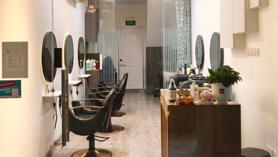 Modern interior of J of Salon, Singapore, SG, showcasing elegant styling stations and decor.