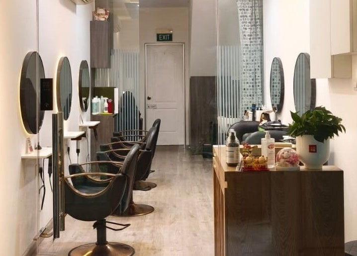 Modern interior of J of Salon, Singapore, SG, showcasing elegant styling stations and decor.