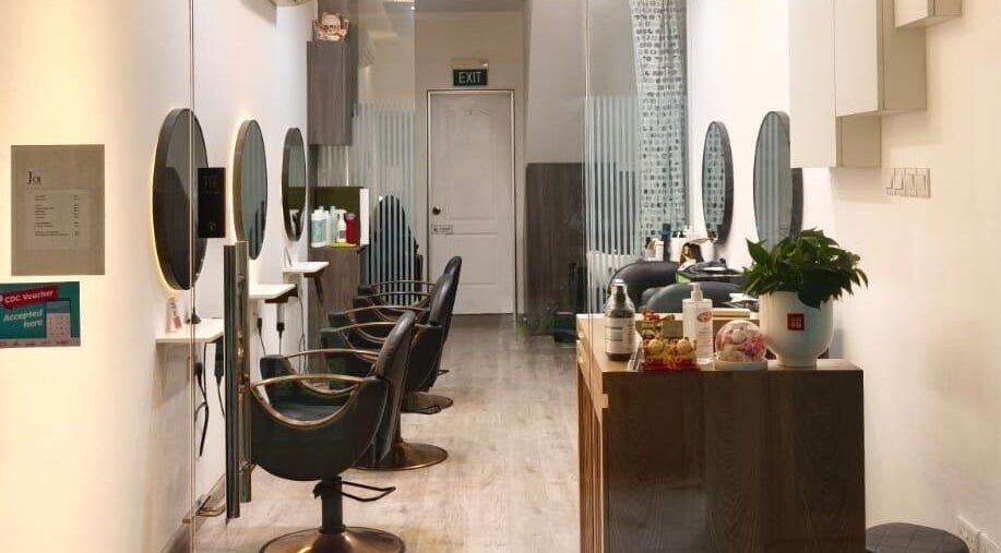 Modern interior of J of Salon, Singapore, SG, showcasing elegant styling stations and decor.