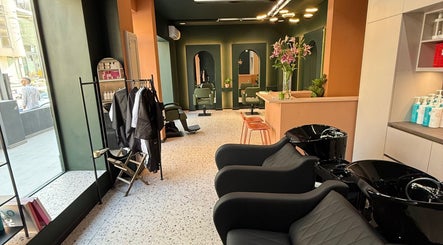 Stylish interior of soBlonde hair boutique, Naxxar, MT, featuring modern chairs and elegant design.