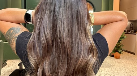Stunning brunette hairstyle at soBlonde hair boutique in Naxxar, MT, showcasing silky, wavy locks.