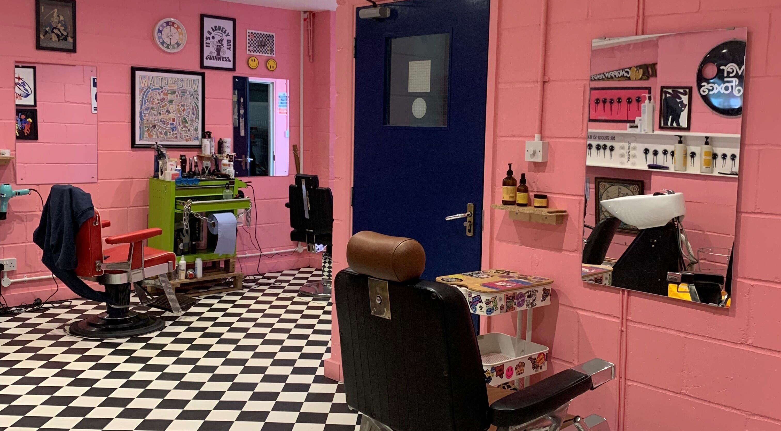 Colorful interior of Little Trimz salon in London, England, GB with retro chairs and stylish decor.