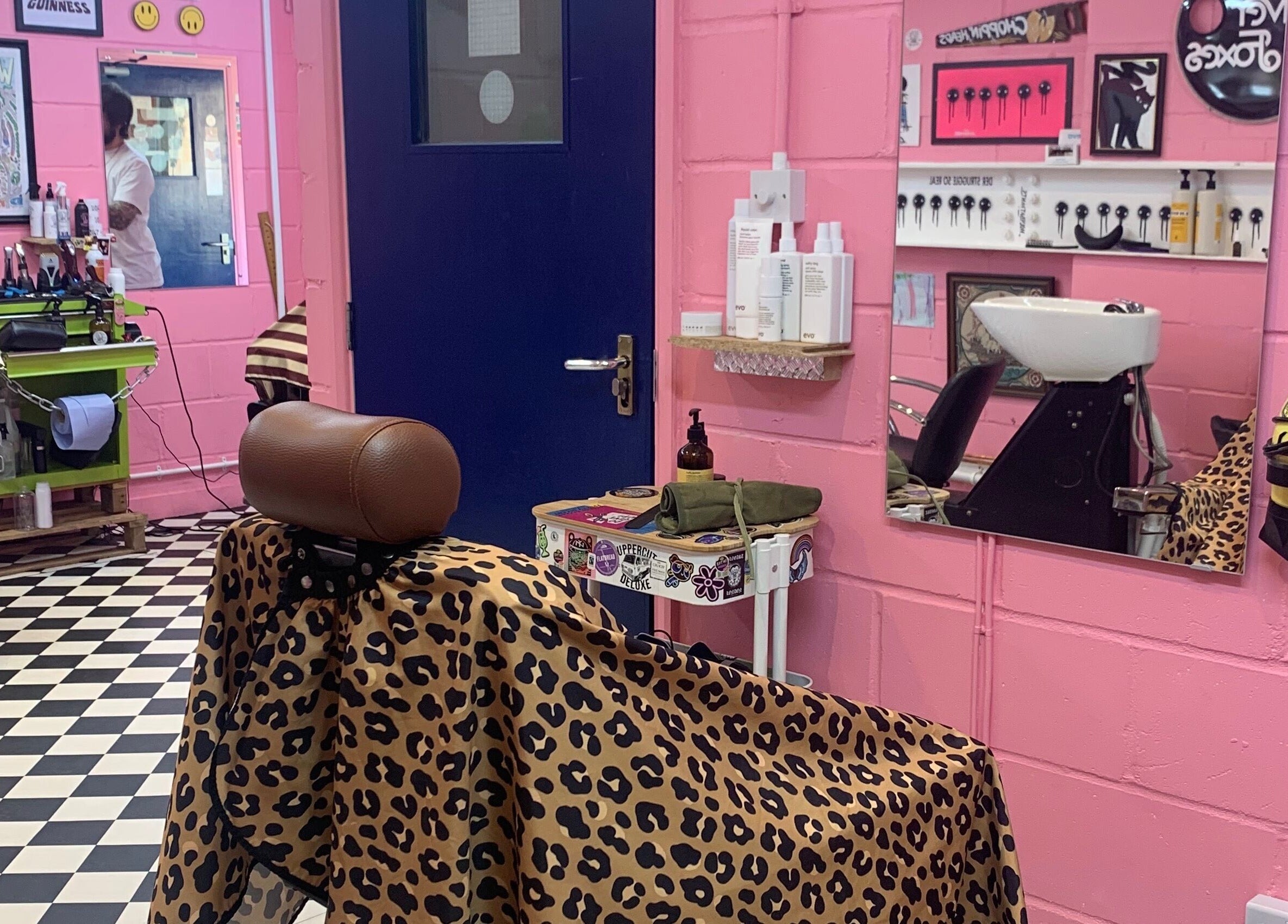 Vibrant pink and leopard-themed salon chair at Little Trimz, London, England, GB. Perfect blend of style and comfort.