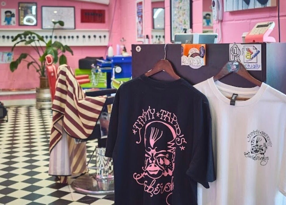 Trendy interior at Little Trimz, London, England, GB, featuring stylish decor and barber shirts.