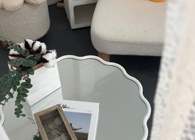 Cozy decor at Peggy Beauty, Lansvale, New South Wales, AU, featuring a chic table and plush seats.