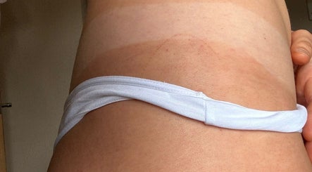 Glow Era's spray tan results at Rochester, England, GB, displaying even, seamless finish.