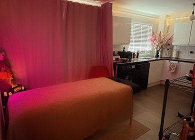 Cozy treatment room at Glow Era with ambient lighting in Rochester, England, GB.