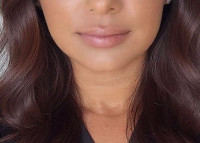 A woman's luxurious, styled hair at Glow Era salon, Rochester, England, GB.
