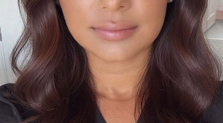 A woman's luxurious, styled hair at Glow Era salon, Rochester, England, GB.