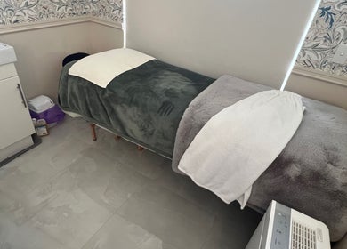 Serene treatment room at Derma Lift Studio, Winthrop, Western Australia, AU, featuring a plush massage bed.
