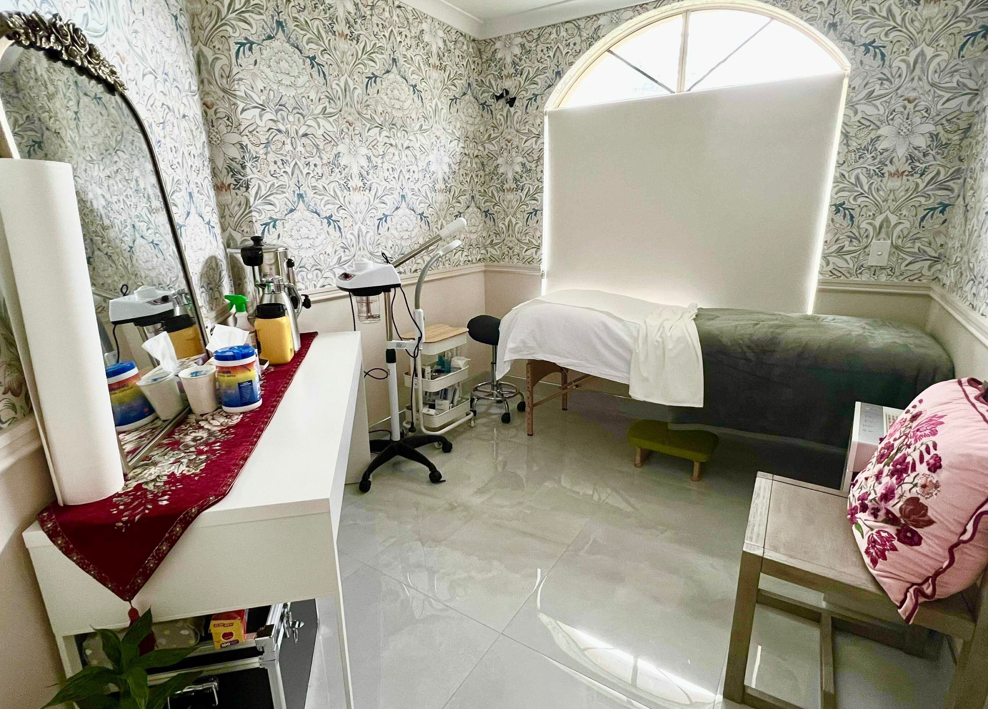 Serene treatment room at Derma Lift Studio, Winthrop, Western Australia, AU, featuring floral decor.