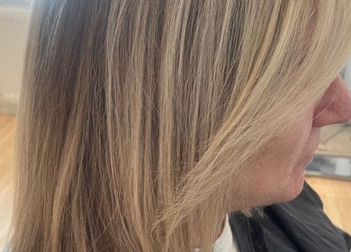 Smooth blonde hair styled at Ali @ No. 17, East Kilbride, Scotland, GB showcasing sleek salon results.