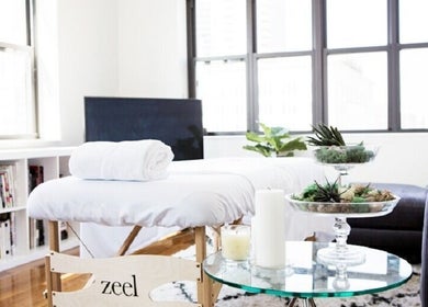 Serene massage setting at AQUILA HEALTH & BEAUTY Dubai| Home Services, in Dubai, Dubai, AE with spa essentials.
