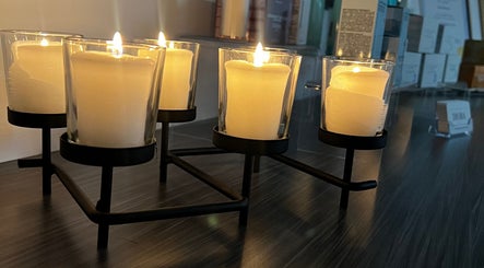 Elegant candles lit at Diora Med Spa, Milton, Ontario, CA creating a tranquil ambiance.