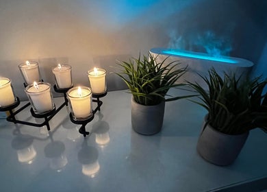 Candles and plants create a calming ambiance at Diora Med Spa in Milton, Ontario, CA.