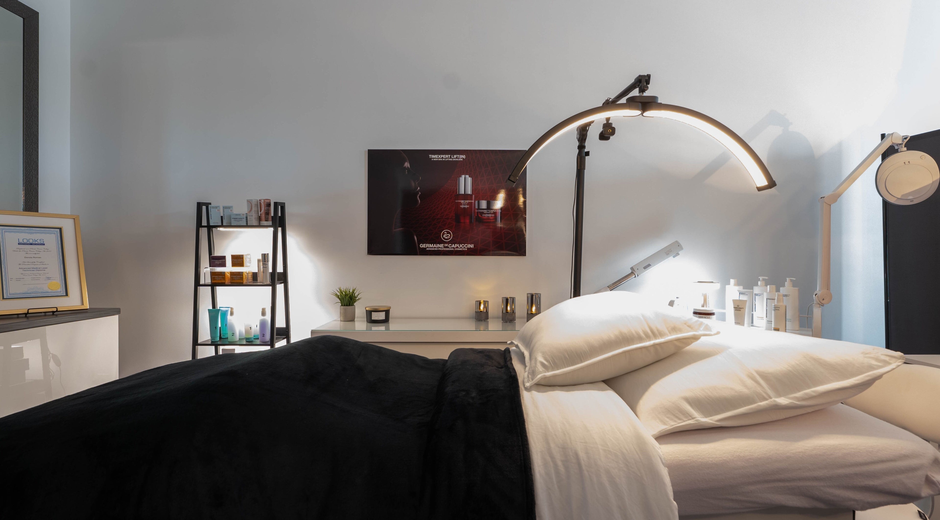 Luxurious treatment room at Diora Med Spa, Milton, Ontario, CA, featuring a plush bed and ambient lighting.